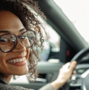 Smiling woman driving a car