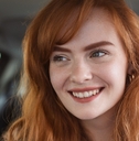 Smiling woman driving a car