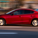 red mazda 3 moving