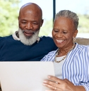 Senior couple relaxing watching movie