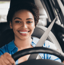 Smiling woman driving a car