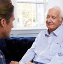adult son talking to his father