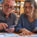 senior couple managing bills