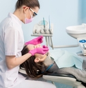 female dentist with dental tools