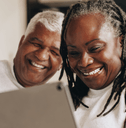 retired couple on tablet