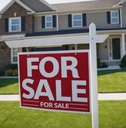 Red &#x27;For Sale&#x27; sign in a grassy yard