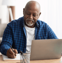 person in their 60s at laptopa