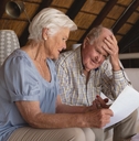 senior couple discussing over medical bills