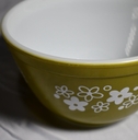 green pyrex bowl on white table cloth