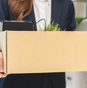 business woman holding her belongings