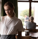 sad waiter in restaurant with tips