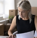 woman sit at office desk work with business papers