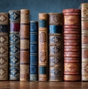 Old antiques books on wooden shelf