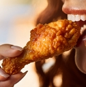 eating a chicken wing