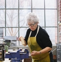 art jeweler working in studio