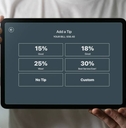 Man holding a tablet with tipping screen