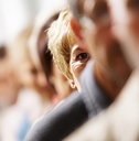 A woman out of focus with a group of people
