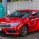 red honda civic in a parking lot