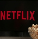 Netflix on TV with popcorn