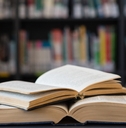 Close up of open books on table