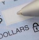 close up of pen writing the dollar amount