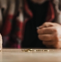 Poor senior man is counting change