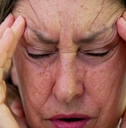 A senior woman stressed