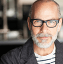man in his 50&#x27;s with glasses looking into the camera