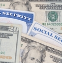 New and Old style Social Security cards with 20 dollar bills