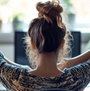stretching at her desk
