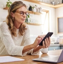 thinking mature person with technology