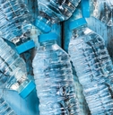 bottles of water on a wooden table