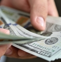 businessman counts money in hands