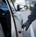 thief opening car door