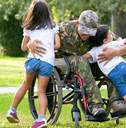 Disabled veteran hugging children