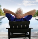 Senior man relaxing by the pool