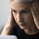 stressed woman working using laptop