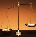 balance scale on orange background