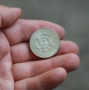 old coin half dollar in hand