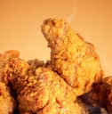 Fried chicken on orange background