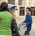 young man moving into dormitory
