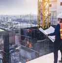 engineer inspecting and working outdoors