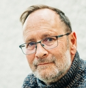 portrait of 50 year old man wearing brown pullover