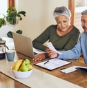 senior couple reading documents