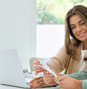 couple sitting at laptop with papers