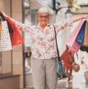 woman holding shopping bags looking happy