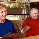 Senior couple with menu books in restaurant