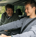 Father teaching teen son to drive