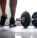 Man starting to exercise with dumbbell