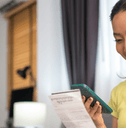 person paying bills on phone